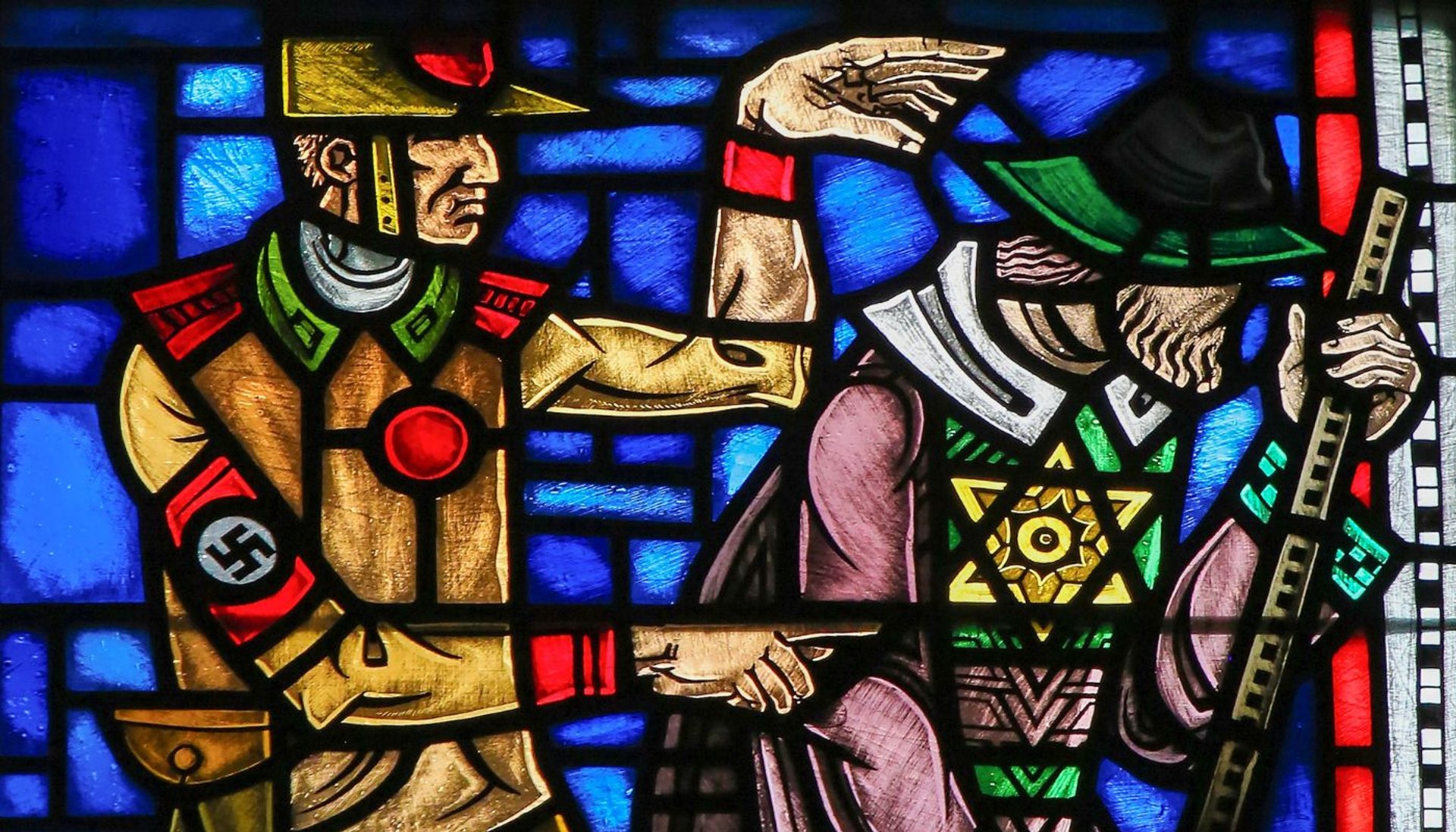 Stained glass window denouncing the Nazis' evil acts