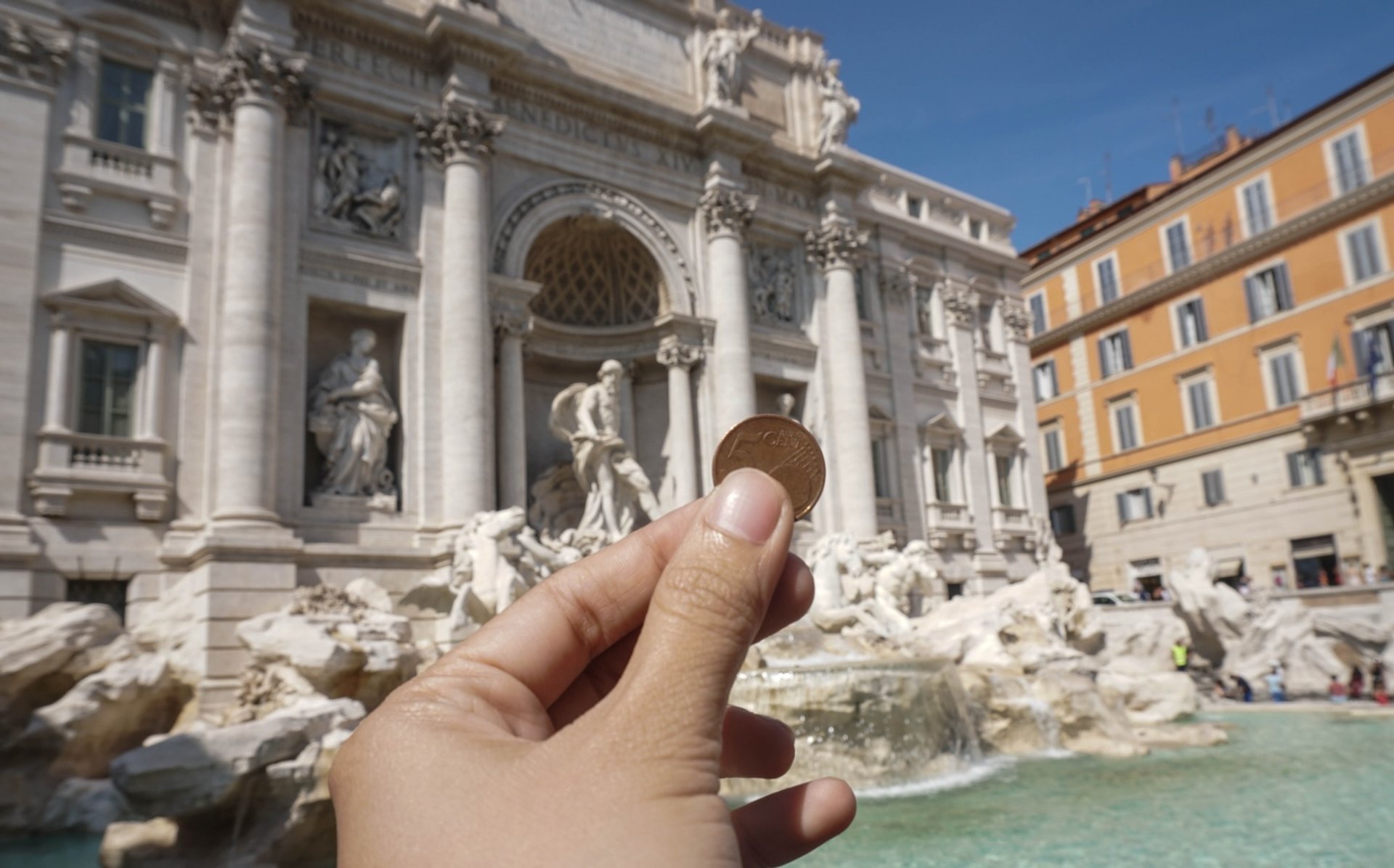 Trevi Fountain Rome tourist coin hope luck