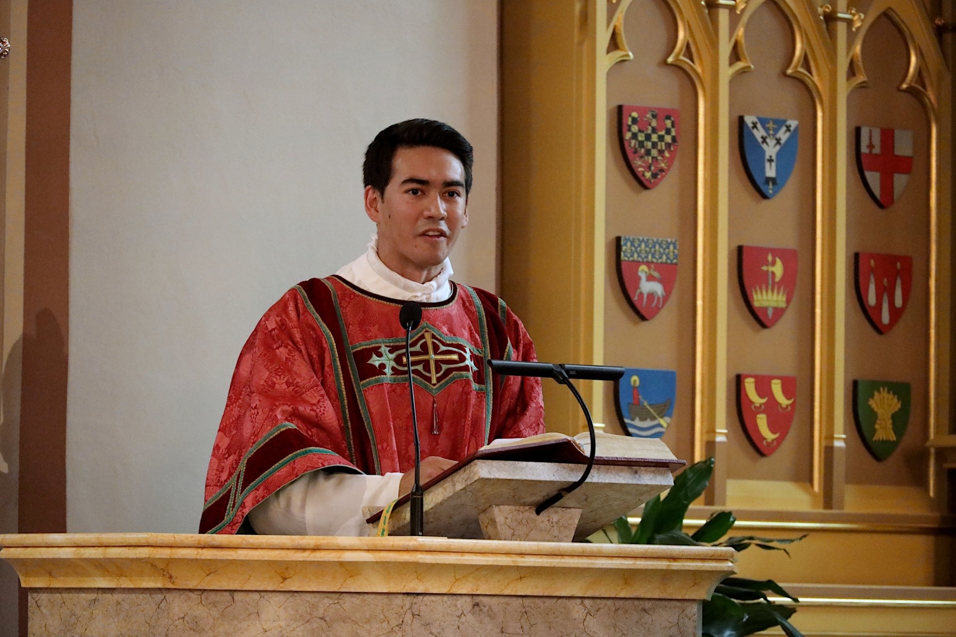 Deacon Mathias Bruno Ledum addresses congregation at his ordination in Oslo, Norway