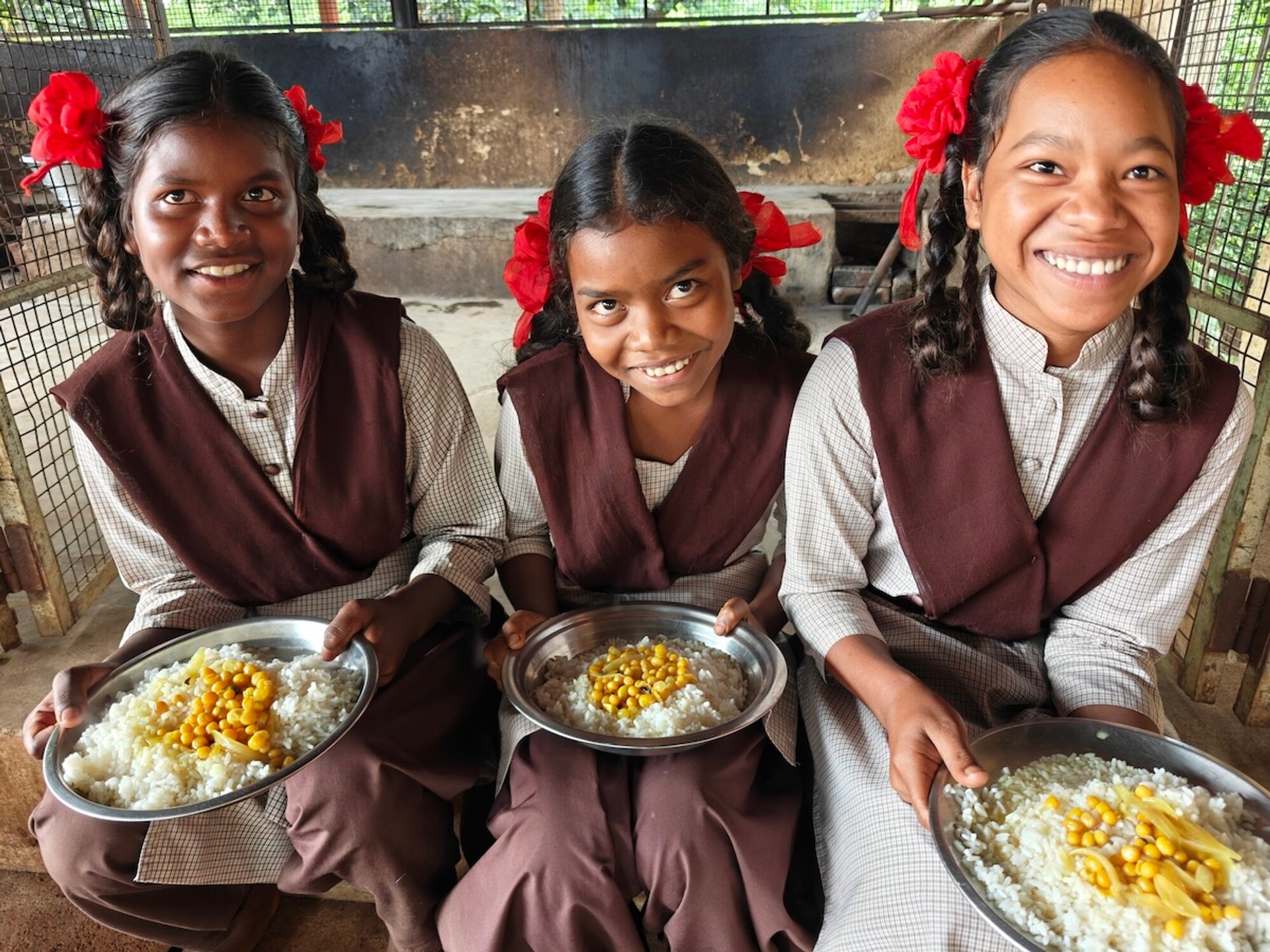 Girls-receiving-school-meals-in-class-in-India.jpg