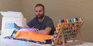 The doctor who hand sews a blanket for every baby he delivers