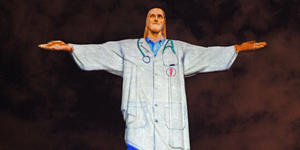 Rio’s Christ the Redeemer lit up as a doctor for Easter greetings