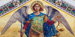 Why is St. Michael depicted holding scales?