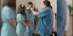 Instead of a wedding dress, she wore scrubs! Doctors marry in Ukraine hospital