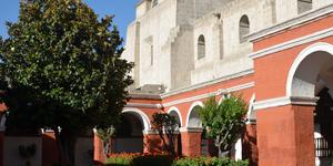 A monastery surrounded by three volcanoes