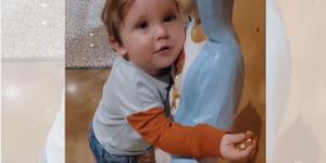 Viral video of cute toddler hugging a statue of Mary
