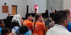 Eucharistic pilgrims sing, clap and sway their way through Atlanta