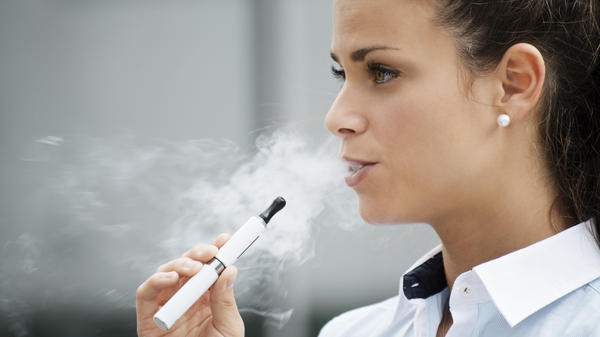 WOMAN SMOKES,