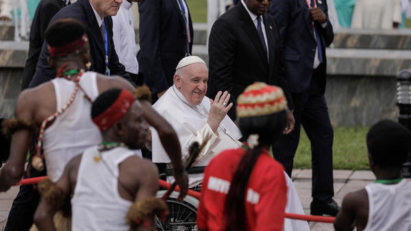 Pope-Francis-seated-on-a-wheelchair-waves-as-he-arrives-at-the-Ndjili-International-Airport-in-Kinshasa-AFP