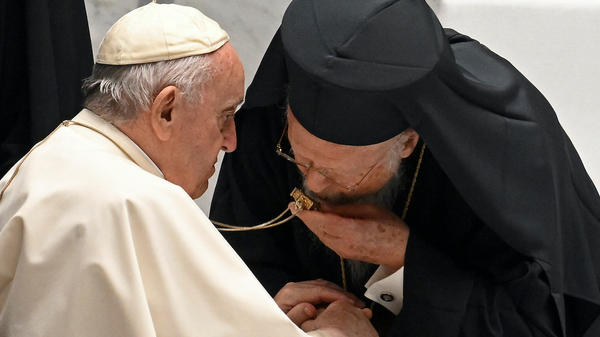 Ecumenical Patriarch Bartholomew I reverences pectoral cross of Pope Francis