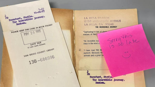 Library book and sticky note apology