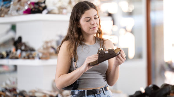 girl picking shoes in the store
