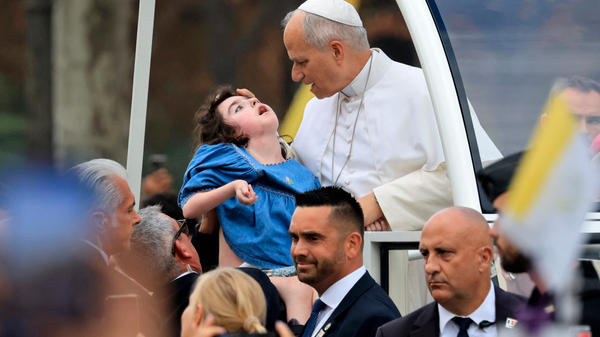 pope-leo-xiv-blesses-child-papamobile-champs-elysees-paris-september-26-2026