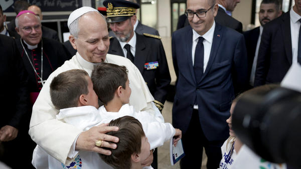 pope-leo-xiv-embraces-children-choir-philippe-ballot-pascal-bolot-laurent-nunez-metz-france-september-28-2026