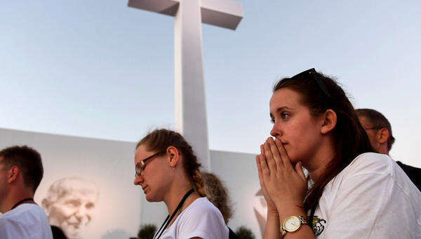 Young people praying during the WYD in Krakow, Poland, in 2016