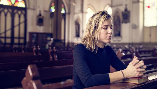 WOMAN PRAYING