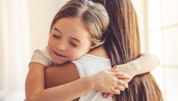 MUM AND KID HUGGING