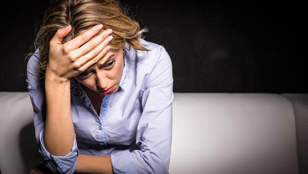 ANXIOUS WOMAN SITTING