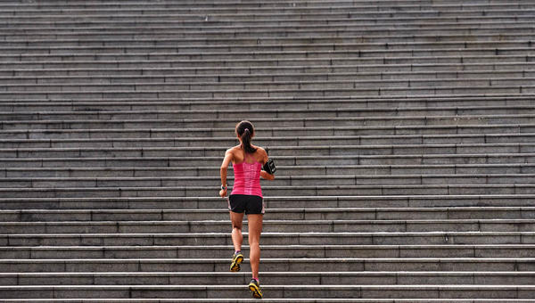 WOMAN RUNNING STAIRS