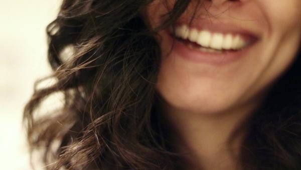 YOUNG WOMAN SMILING