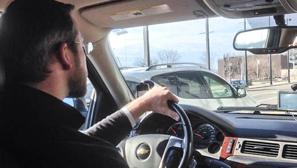 MAN DRIVING A CAR