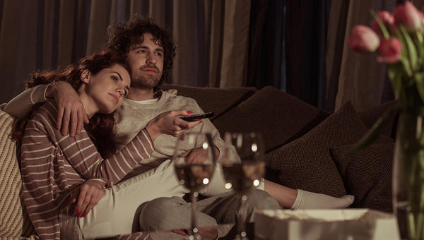 A COUPLE WATCHING TV
