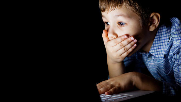 CHILD USING LAPTOP