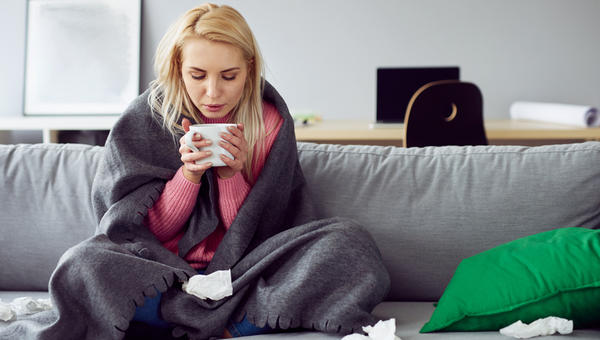 WOMAN,SICK,COUCH,TEA