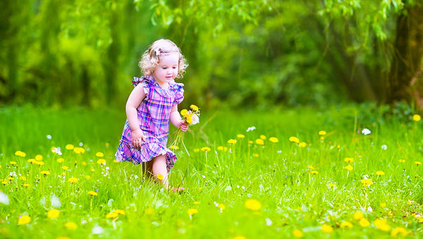 LITTLE GIRL PLAYING GARDEN