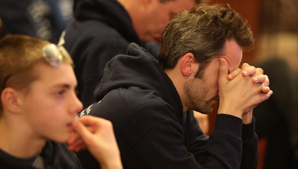 MAN,PRAYING,CATHOLIC,MASS