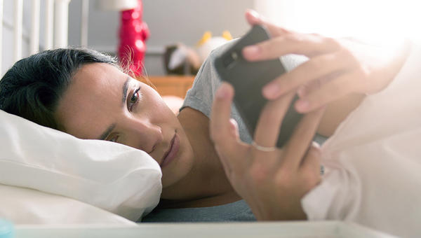 WOMAN CHECKING PHONE