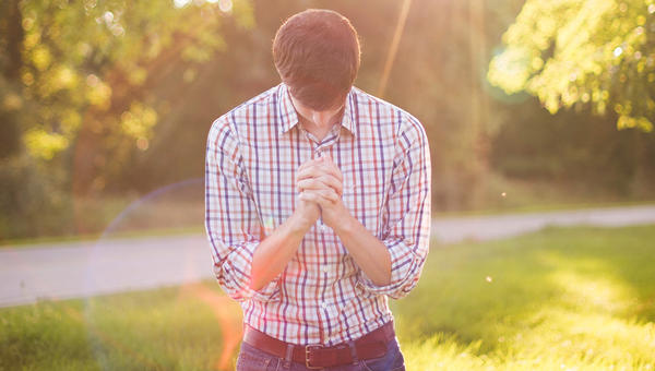 YOUNG,MAN,PRAYING