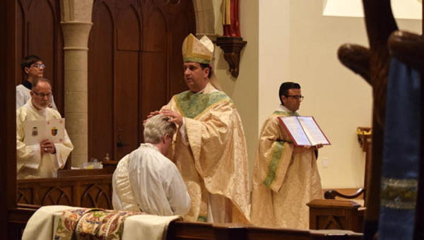 PRIEST BEING ORDAINED