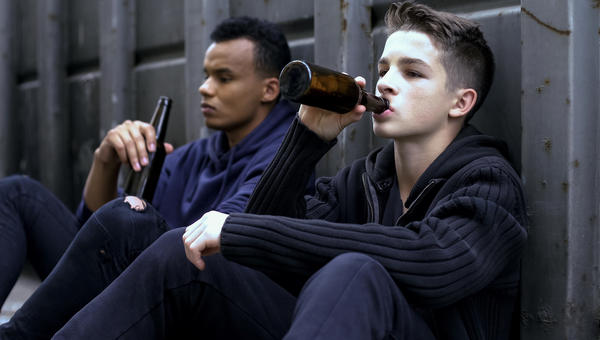 teenager guys drinking beer