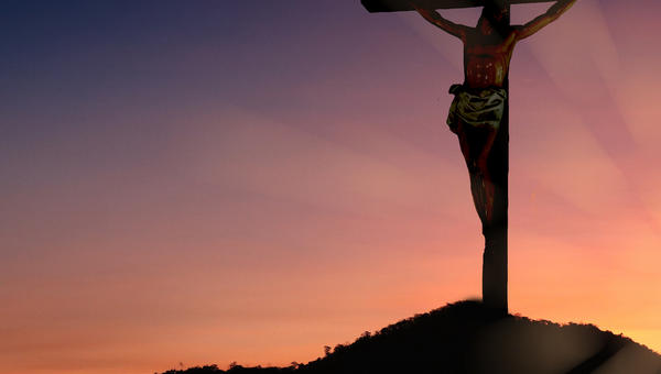 The crucifixion of Jesus Christ on the mountain has a background as before the sunset