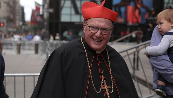 Cardinal Dolan smiling at public event