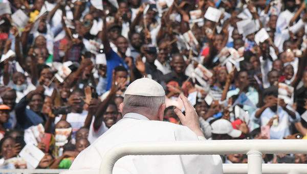 Pope-Francis-waves-as-he-arrives-by-popemobile-for-a-meeting-with-young-people-and-catechists-at-Martyrs-Stadium-in-Kinshasa-AFP