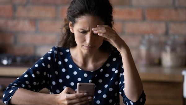 woman having problems with mobile phone