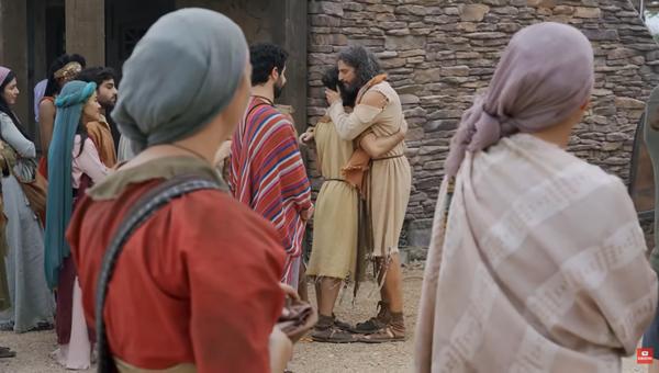 Jonathan Roumie as Jesus hugging Andrew in The Chosen