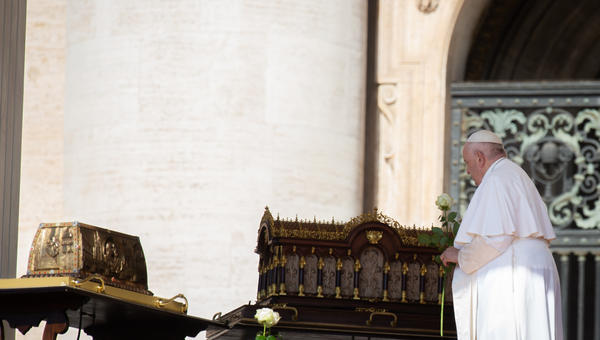 Pope Francis stands by the relics of Saint Therese of Lisieux