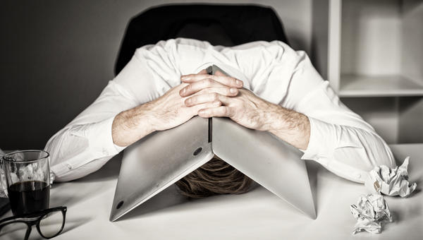 burnout man with laptop on head