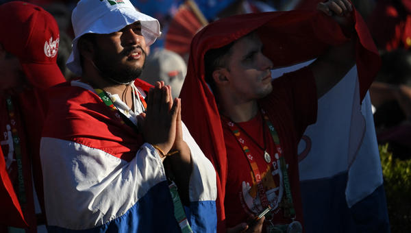 French pilgrims attend the Stations of the Cross ceremony presided over by Pope Francis in Edward VII Park