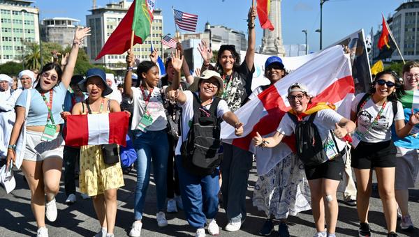 Pilgrims attend the opening mass of the World Youth Day 2023