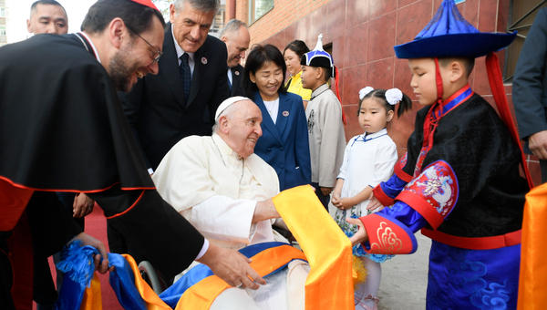 children greeting Pope Francis upon his arrival at the Apostolic Prefecture of Ulaanbaatar