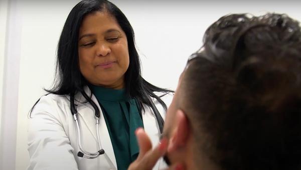 doctor exam woman Latino