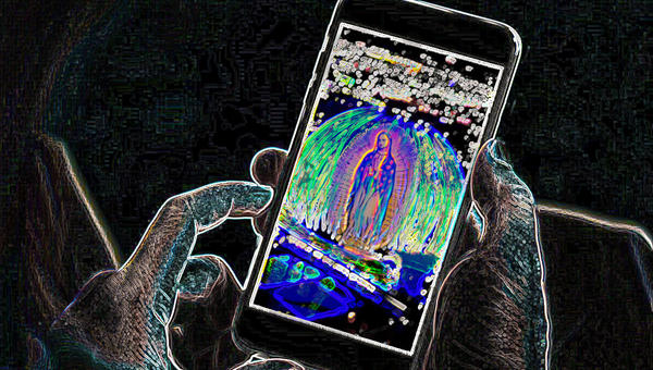 Digitized vision of Our Lady of Guadalupe on phone