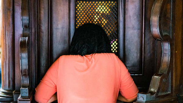woman-confession-kneel-Catholic-