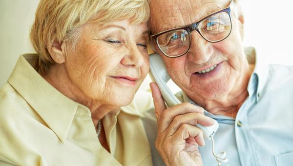 Elderly couple on phone