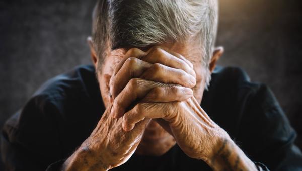 Elderly person praying