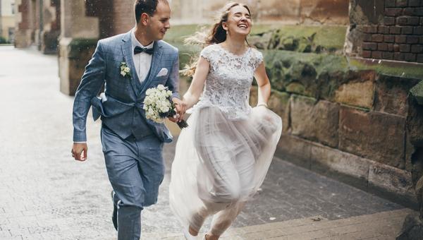 Couple running rain